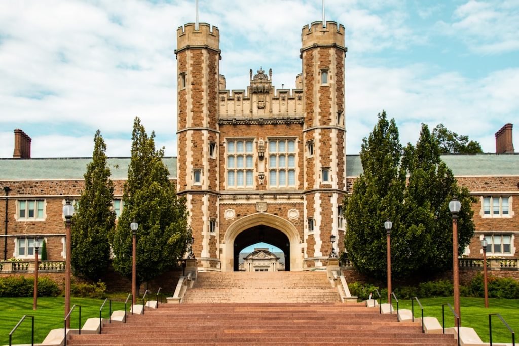 a-brick-building-with-a-large-arched-doorway-and-a-brick-walkway-xymx1zijju4